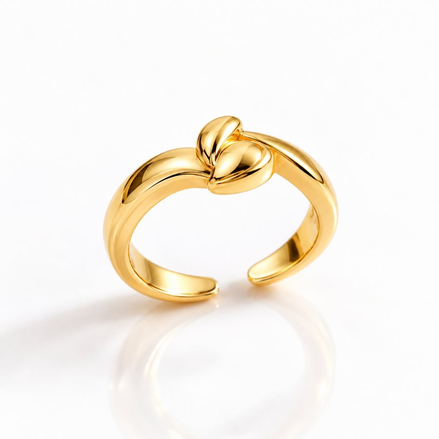 Gold open-band ring with a sculpted knot detail